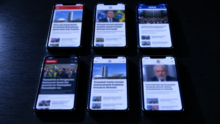 Seis celulares lado a lado mostrando versões diferentes da mesma notícia